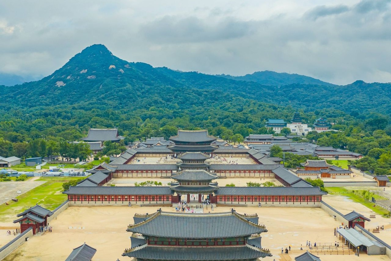 Aerial view of Gyeongbokgung Palace with Bugaksan mountain behind