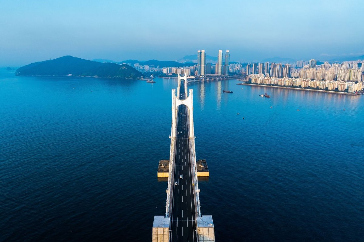 Gwangan Bridge in Busan lit up over the water