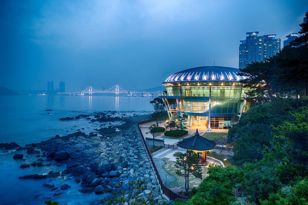 Nurimaru APEC House on Dongbaekseom with its glass roof and the sea behind