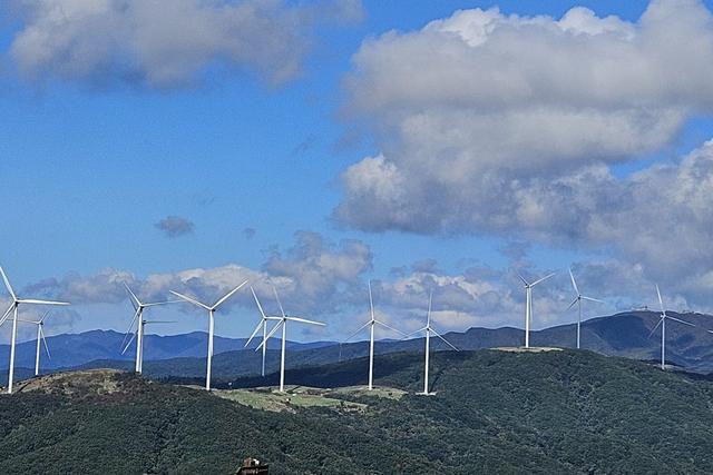 Wind turbines along a mountain ridge near Sky Ranch in Pyeongchang