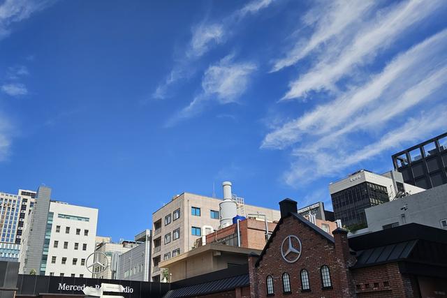 A red-brick building in Seongsu-dong, Seoul, under a blue sky